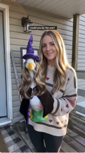 the woman carrry a porch goose with beautiful outfits